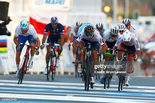 Peter Sagan of Slovakia leads Mark Cavendish of Great Britain as they approach the finish line of the Elite Men's Road Race on day eight of the UCI...