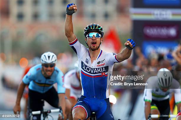 Peter Sagan of Slovakia celebrates victory as he crosses the finish line in the Elite Men's Road Race on day eight of the UCI Road World...