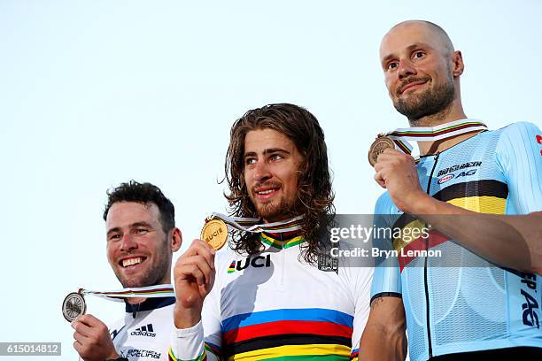 Peter Sagan of Slovakia celebrates victory on the podium next to second-placed Mark Cavendish of Great Britain and third-placed Tom Boonen of Belgium...