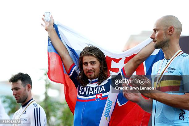 Peter Sagan of Slovakia celebrates victory on the podium next to second-placed Mark Cavendish of Great Britain and third-placed Tom Boonen of Belgium...