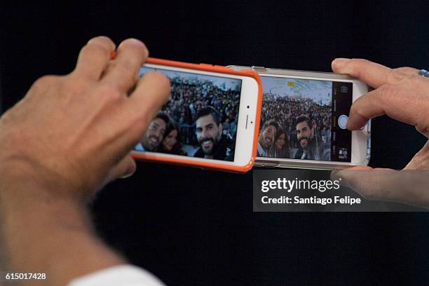 David Chocarro, Nohelia Castro and Juan Pablo Llano pose for a selfie with the crowd during the 5th Annual Festival People en Espanol at The Jacob K....