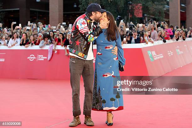 Jovanotti and Francesca Valiani walk a red carpet during the 11th Rome Film Festival at Auditorium Parco Della Musica on October 16, 2016 in Rome,...