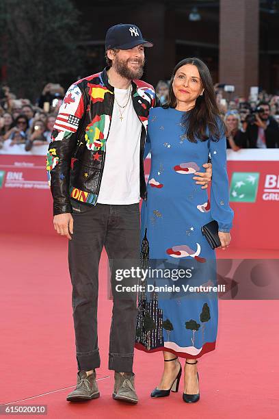 Jovanotti and Francesca Valiani walk a red carpet during the 11th Rome Film Festival at Auditorium Parco Della Musica on October 16, 2016 in Rome,...