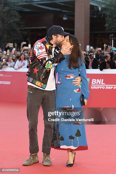 Jovanotti and Francesca Valiani walk a red carpet during the 11th Rome Film Festival at Auditorium Parco Della Musica on October 16, 2016 in Rome,...