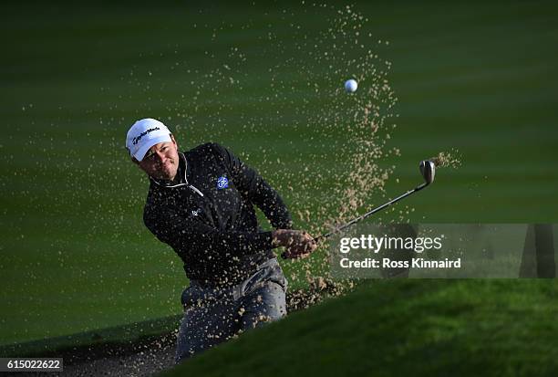 Richard Sterne of South Africa plays his third shot on the 18th hole uring the fourth round of the British Masters at The Grove on October 16, 2016...