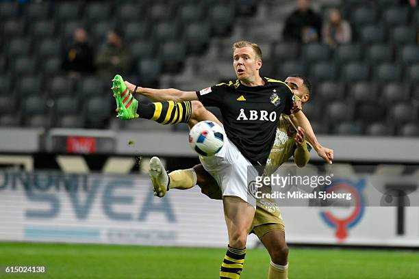 Per Karlsson of AIK and Alex Dyer of Ostersunds FK during the allsvenskan match between AIK and Ostersunds FK at Friends arena on October 16, 2016 in...