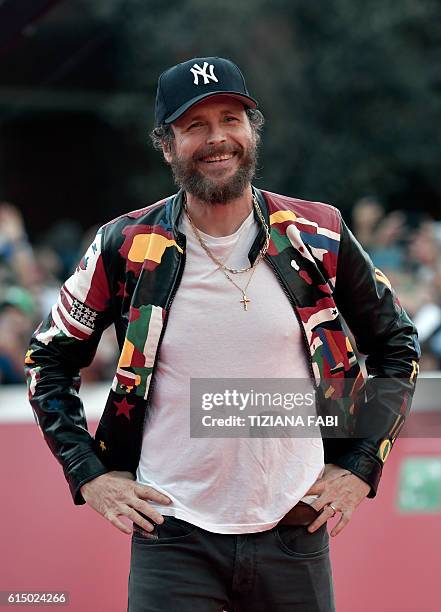 Italian singer Lorenzo Cherubini Jovanotti poses on the red carpet during the 11th Rome Film Festival on October 16, 2016 in Rome. / AFP / TIZIANA...