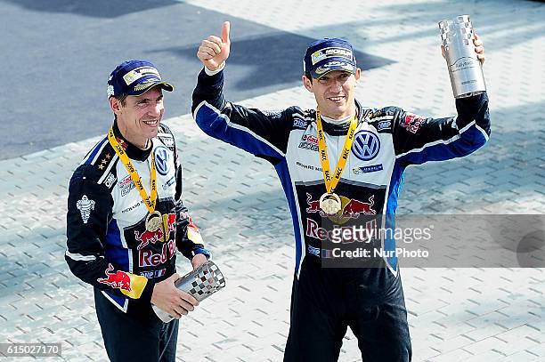 The French driver Sbatien Ogier, and his co-driver Julien Ingrassia of Volkswagen Motorsport, celebrating their 4th World Rally Championship victory,...