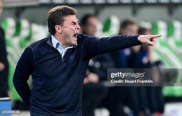 Dieter Hecking, head coach of Wolfsburg reacts during the Bundesliga match between VfL Wolfsburg and RB Leipzig at Volkswagen Arena on October 16,...