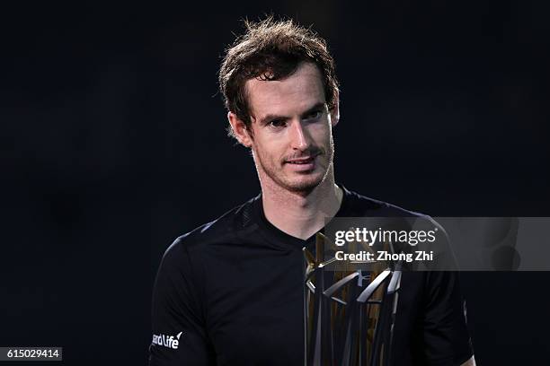 Andy Murray of Great Britain celebrates with his trophy during the award ceremony after winning the Men's singles final match against Roberto...