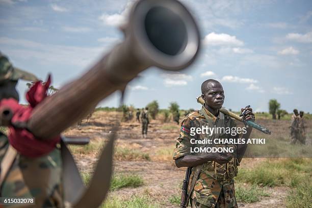 Sudan People Liberation Army soldiers patrol in Alole, northern South Sudan, on October 16, 2016. Heavy fighting broke out on October 14 between SPLA...