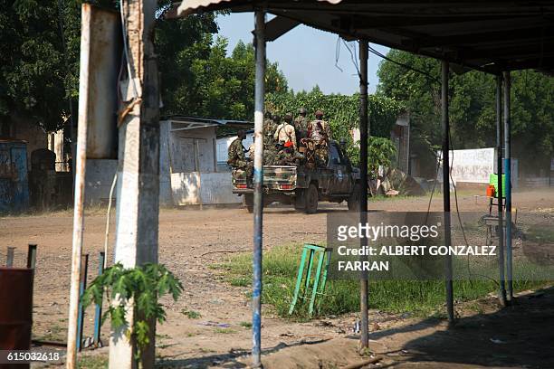 Soldiers of the Sudan People Liberation Army patrol Malakal, northern South Sudan, on October 16, 2016. Heavy fighting broke out on Ocotober 14...