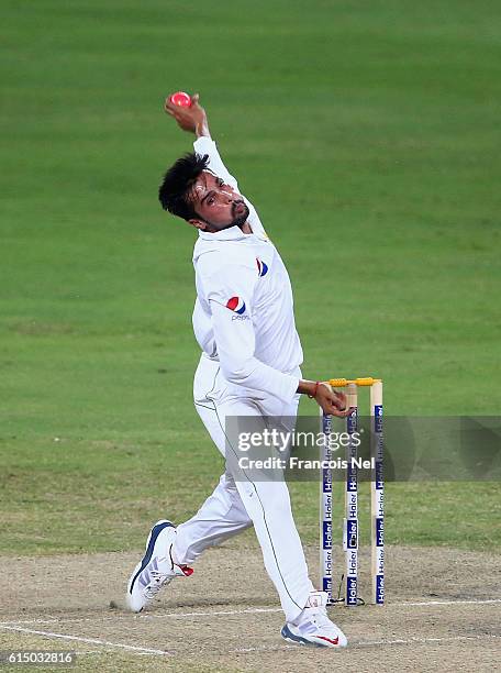 Mohammad Amir of Pakistan bowls during Day Four of the First Test between Pakistan and West Indies at Dubai International Cricket Ground on October...