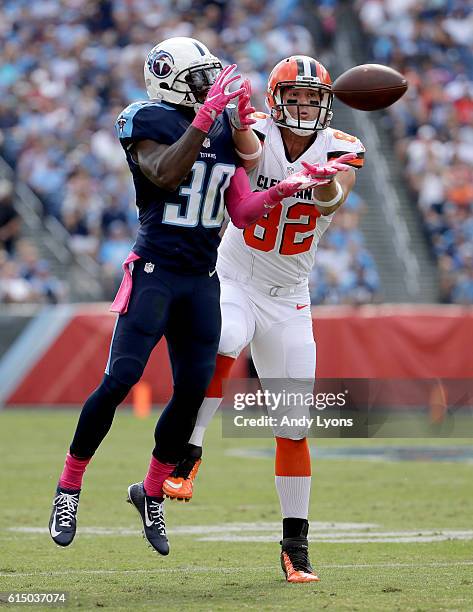 Jason McCourty of the Tennessee Titans breaks up a pass to Gary Barnidge of the Cleveland Browns during the second quarter of the game at Nissan...