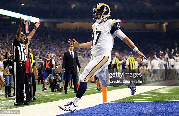 Case Keenum of the Los Angeles Rams celebrates after scoring a touchdown against the Detroit Lions during first half action at Ford Field on October...