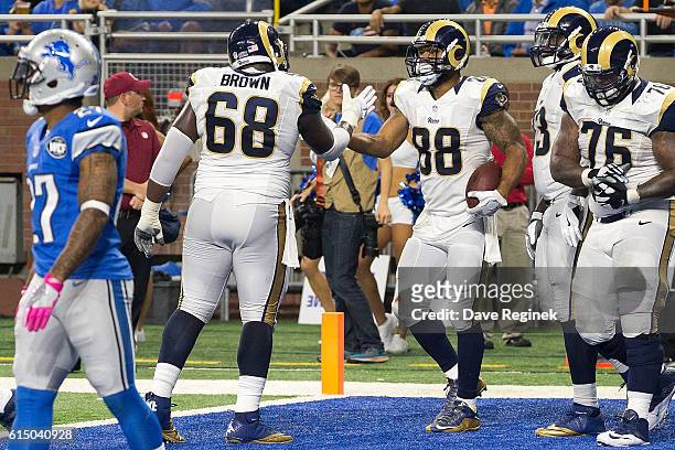 Tight end Lance Kendricks of the Los Angeles Rams celebrates his third quarter touchdown with teammate offensive guard Jamon Brown during an NFL game...