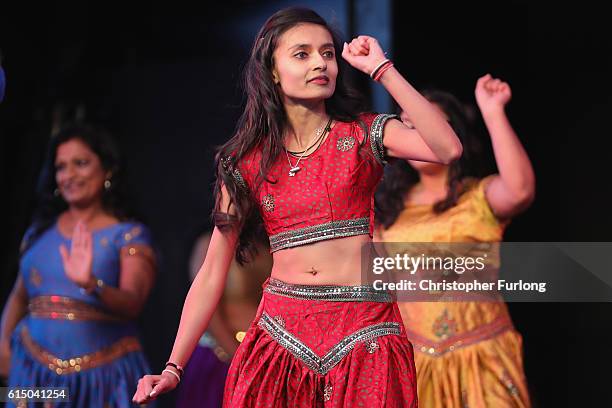 Traditional dancers entertain the thousands of people gathering on Leicester's Golden Mile to watch the switching on of the lights to mark the start...