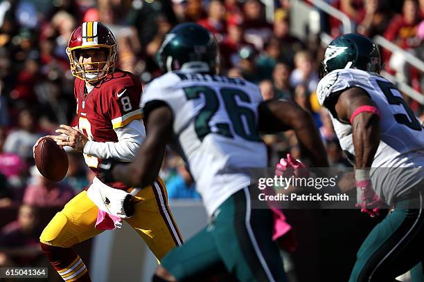 Quarterback Kirk Cousins of the Washington Redskins looks to pass the ball against defensive back Jaylen Watkins of the Philadelphia Eagles in the...