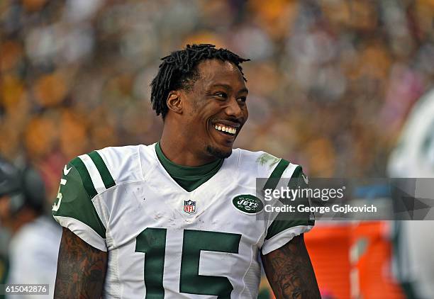 Wide receiver Brandon Marshall of the New York Jets smiles as he looks on from the sideline during a game against the Pittsburgh Steelers at Heinz...