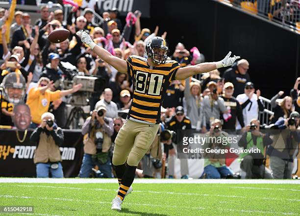 Tight end Jesse James of the Pittsburgh Steelers celebrates after scoring a touchdown on a one-yard pass play during a game against the New York Jets...