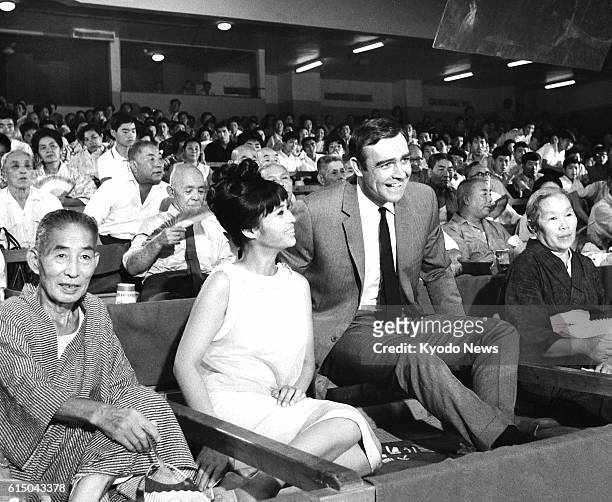 Japan - File photo shows Sean Connery as James Bond, and Japanese actress Akiko Wakabayashi as a Bond girl, while shooting a scene for the movie "You...
