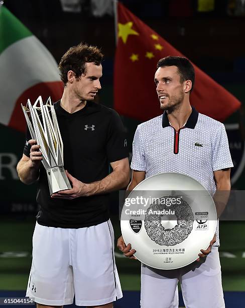 Andy Murray of Great Britain and Roberto Bautista Agut of Spain poses with their trophy after the Men's Single Final Match on day eight of Shanghai...
