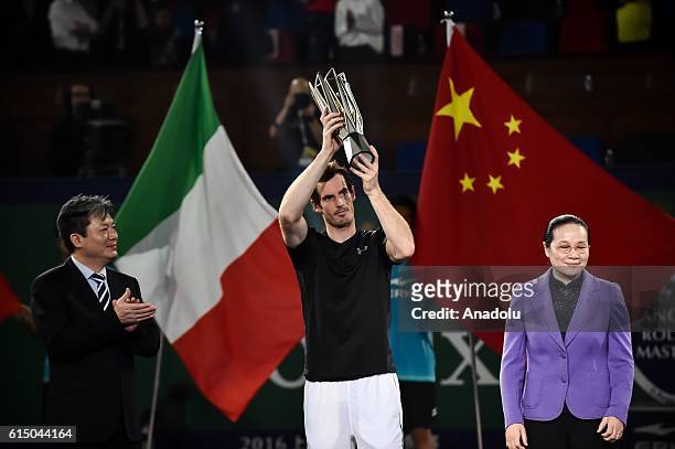 Andy Murray of Great Britain celebrates with his trophy during the award ceremony after winning the Men's singles final match against Roberto...