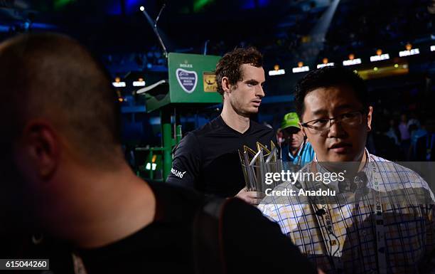 Andy Murray of Great Britain poses with his trophy after the Men's Single Final Match on day eight of Shanghai Rolex Masters at Qi Zhong Tennis...