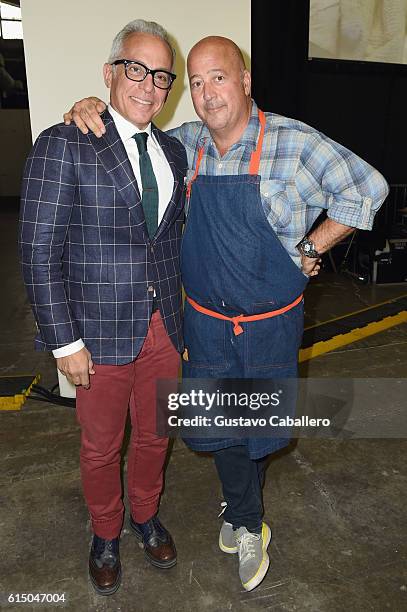 Chefs Geoffrey Zakarian and Andrew Zimmern pose during the Grand Tasting presented by ShopRite featuring Samsung culinary demonstrations presented by...