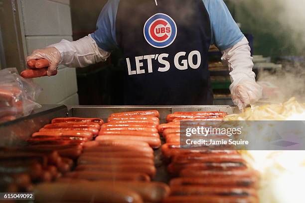 Vendor cooks hot dogs prior to game one of the National League Championship Series between the Chicago Cubs and the Los Angeles Dodgers at Wrigley...