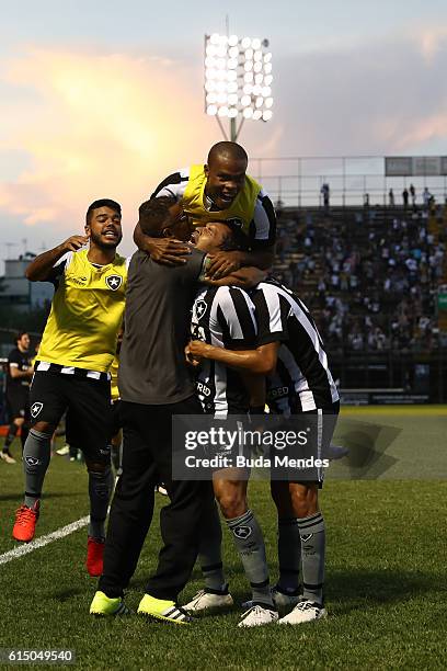 Players of Botafogo celebrate a scored goal against Atletico Mineiro during a match between Botafogo and Atletico Mineiro as part of Brasileirao...