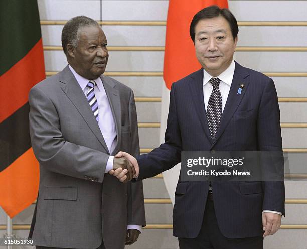 Japan - Zambian President Michael Sata and Japanese Prime Minister Yoshihiko Noda shake hands before their meeting in Tokyo on Oct. 10, 2012.