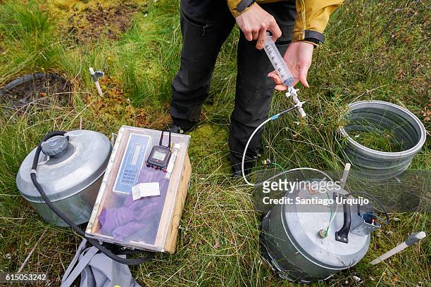 researcher measuring methane and co2 emissions from peatland - carbon capture stock pictures, royalty-free photos & images