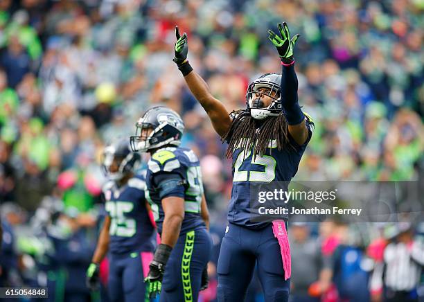 Cornerback Richard Sherman of the Seattle Seahawks gets the crowd going against the Atlanta Falcons at CenturyLink Field on October 16, 2016 in...