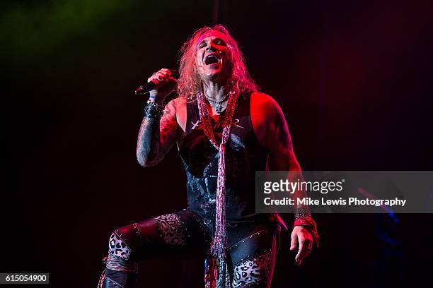 Michael Star from Steel Panther performs on stage at Motorpoint Arena on October 16, 2016 in Cardiff, Wales.