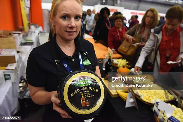 Brand ambassador of Kerrygold poses with Irish whiskey aged cheddar cheese during the Grand Tasting presented by ShopRite featuring Samsung culinary...