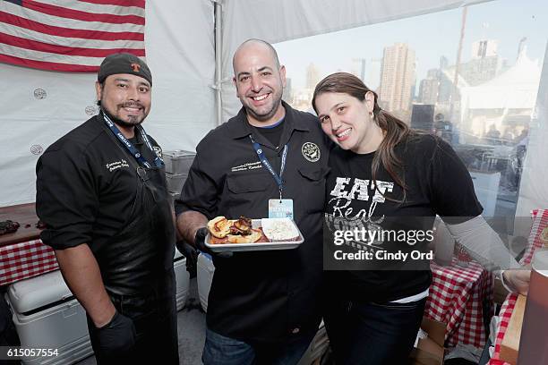 Winners of both the Coke and Smoke BBQ Challenge and Thrillist's People's Choice Award Chef Matthew Katakis and team members for The Butcher Bar...
