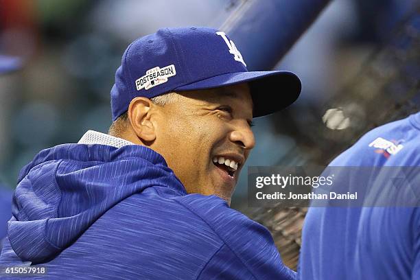 Los Angeles Dodgers manager Dave Roberts reacts prior to game two of the National League Championship Series against the Chicago Cubs at Wrigley...