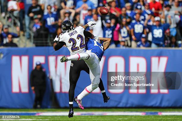 Baltimore Ravens cornerback Jimmy Smith knocks the ball away from New York Giants wide receiver Odell Beckham the game between the New York Giants...