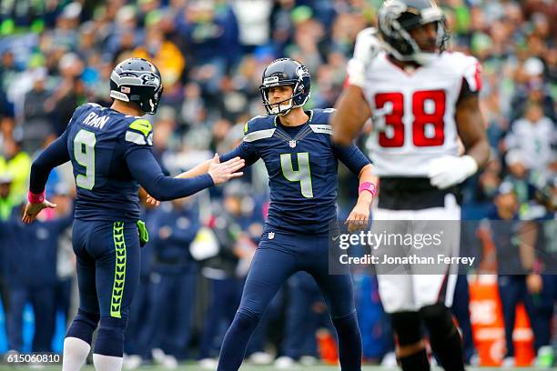 Kicker Steven Hauschka of the Seattle Seahawks celebrates the game-winning field goal with punter Jon Ryan against the Atlanta Falcons at CenturyLink...