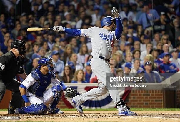 Adrian Gonzalez of the Los Angeles Dodgers hits a solo home run in the second inning against the Chicago Cubs during game two of the National League...