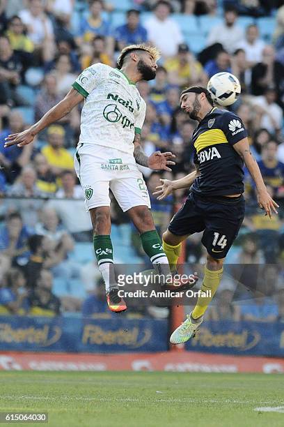 Sebastian Perez of Boca Juniors and Adrian Balboa of Sarmiento jump for a header during a match between Boca Juniors and Sarmiento as part of Torneo...