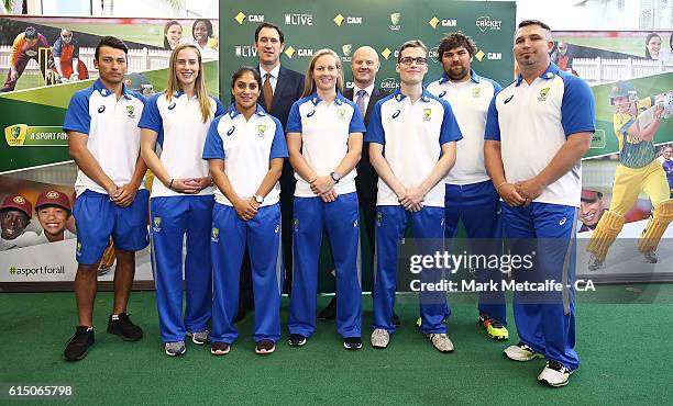 Cricket Australia via Getty Images's CEO, James Sutherland and CEO of Commonwealth Bank, Ian Narev pose with cricketers Ellyse Perry, Meg Lanning and...