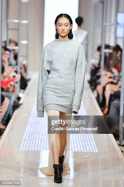 Model walks the runway wearing Mikhael Kale Spring and Summer 2017 collection during FashionCAN at Yorkdale Shopping Centre on October 16, 2016 in...