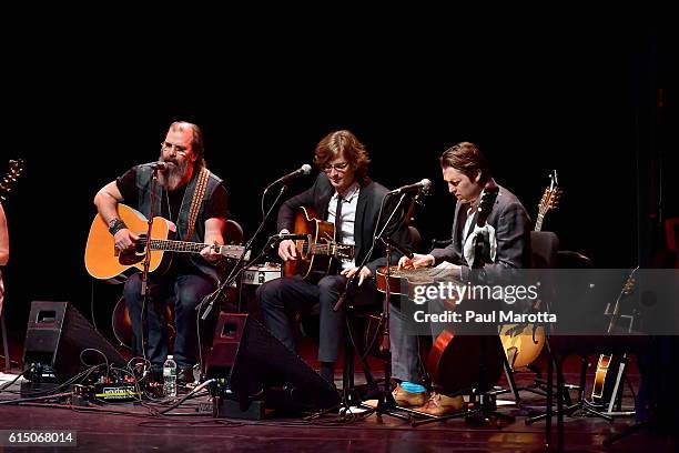 Steve Earle, Joey Ryan and Kenneth Pattengale of The Milk Carton Kids perform during the "Lampedusa: Concerts For Refugees" eleven concert tour to...