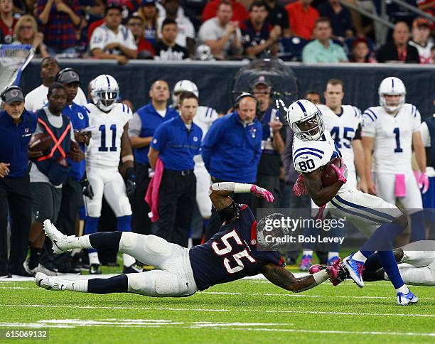 Chester Rogers of the Indianapolis Colts breaks the tackle attempt of Benardrick McKinney of the Houston Texans in the second quarter at NRG Stadium...
