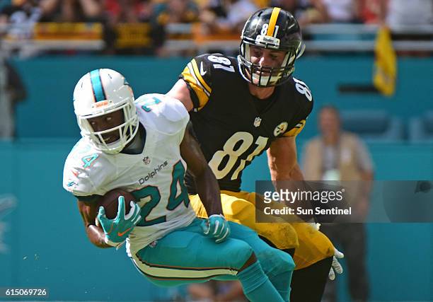 Miami Dolphins strong safety Isa Abdul-Quddus intercepts a pass intended for Pittsburgh Steelers tight end Jesse James on Sunday, Oct. 16, 2016 at...
