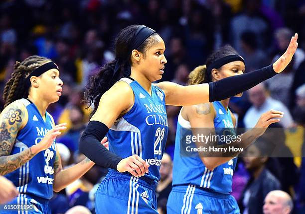 Forward Maya Moore of the Minnesota Lynx celebrates as she leaves the floor with her team leading the Los Angeles Sparks in the fourth quarter at...