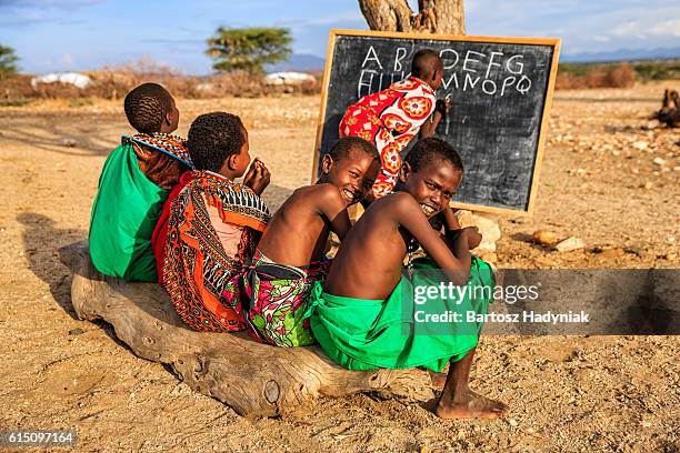 african children during english class, east africa - kenyansk kultur bildbanksfoton och bilder