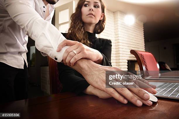 harrassed woman removing his hand. she wears ring. - colleague engagement stock pictures, royalty-free photos & images